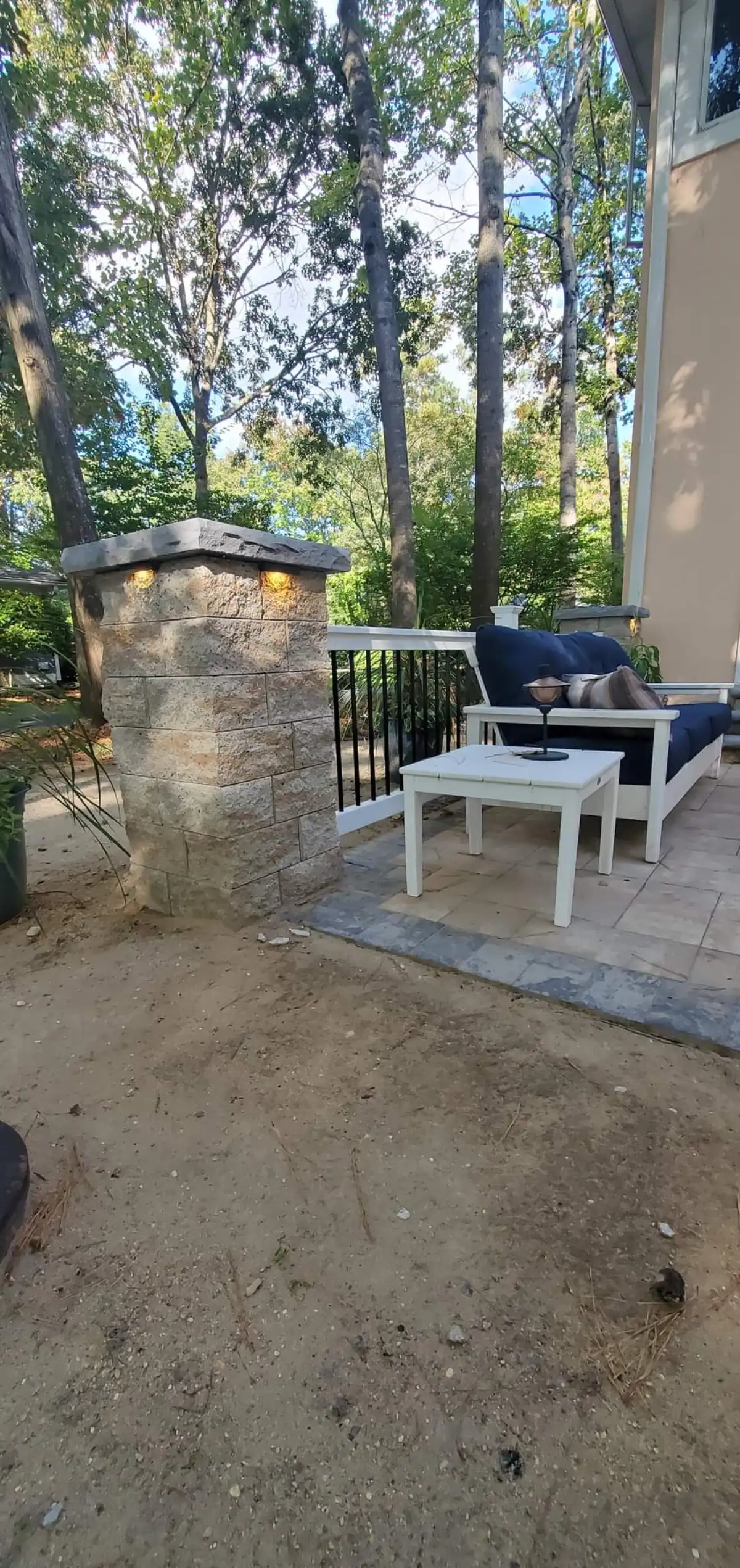 Custom firepit with paver surround and seating wall