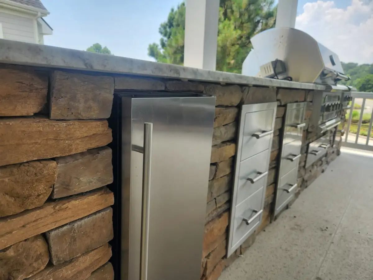Custom outdoor kitchen with built-in grill and countertops