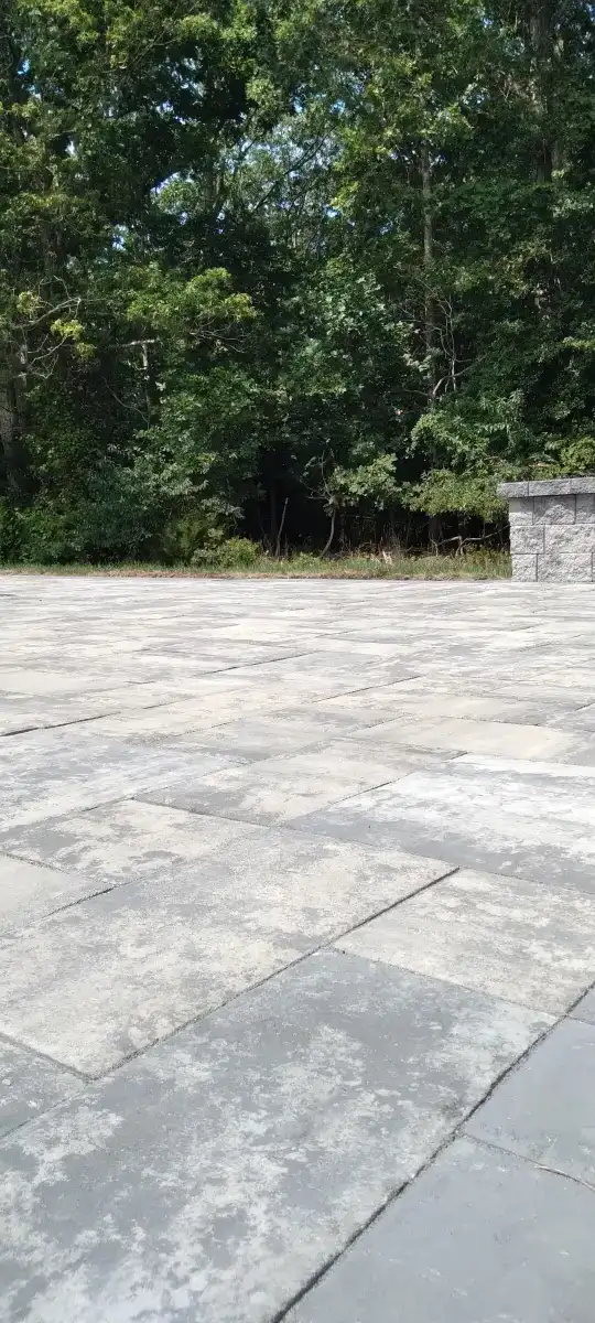 Outdoor kitchen with stone base and built-in grill in Delaware