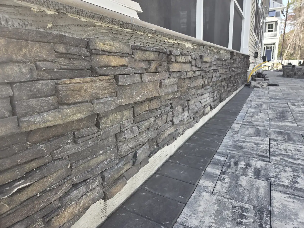 Multi-level paver patio with built-in seating and border design in Sussex County